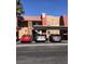 Exterior shot of the apartments with covered parking, desert landscaping and convenient parking spaces at 4421 Alexis Dr # 436, Las Vegas, NV 89103