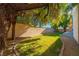 An inviting backyard area featuring lush green grass and mature trees at 4654 Stuttgart St, Las Vegas, NV 89147