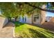 Spacious backyard with a grassy lawn and shade trees at 4654 Stuttgart St, Las Vegas, NV 89147