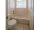 This bathroom includes a toilet, bathtub, and shower combination at 4654 Stuttgart St, Las Vegas, NV 89147