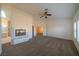 Large carpeted bedroom with ceiling fan and gas fireplace at 4654 Stuttgart St, Las Vegas, NV 89147