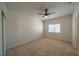 Empty bedroom features neutral walls, carpet flooring, a ceiling fan, and a window at 4654 Stuttgart St, Las Vegas, NV 89147