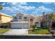 Charming two-story home features a three-car garage, a well manicured lawn, and a beautiful tiled roof at 4654 Stuttgart St, Las Vegas, NV 89147