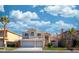 Charming two-story home features a three-car garage, a well manicured lawn, and a beautiful tiled roof at 4654 Stuttgart St, Las Vegas, NV 89147