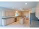 Large kitchen with stainless appliances, island, and light wood cabinetry at 4654 Stuttgart St, Las Vegas, NV 89147