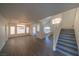 Bright living room features wood floors, large windows, and staircase access at 4654 Stuttgart St, Las Vegas, NV 89147