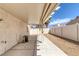 Covered back patio features a concrete floor, ideal for outdoor relaxation and entertaining at 4828 Marco Polo St, North Las Vegas, NV 89031