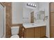 Bathroom featuring tile accents, a toilet, a sink, and a vanity at 4828 Marco Polo St, North Las Vegas, NV 89031