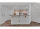 View of open kitchen with breakfast bar and modern appliances at 4828 Marco Polo St, North Las Vegas, NV 89031