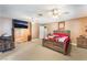 Large bedroom with wooden furniture, neutral walls, and plush carpeting at 4905 Ricky Rd, Las Vegas, NV 89130