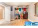 This spacious bedroom has wood floors and neutral colored walls and trim, as well as a ceiling fan at 4905 Ricky Rd, Las Vegas, NV 89130
