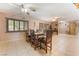 Well-lit dining room featuring a large wooden table and shuttered windows at 4905 Ricky Rd, Las Vegas, NV 89130