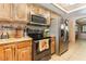 Well-equipped kitchen with stainless steel appliances and granite countertops at 4905 Ricky Rd, Las Vegas, NV 89130