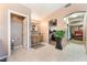 Spacious bathroom with a double sink, walk-in closet, tile floors, and an open doorway to the main bedroom at 4905 Ricky Rd, Las Vegas, NV 89130