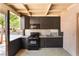 Well-equipped outdoor kitchen with built-in appliances and ample counter space for cooking and serving at 4905 Ricky Rd, Las Vegas, NV 89130