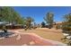 This lush backyard features manicured garden beds with brick paths for easy strolling at 4910 Marywood Ct, Pahrump, NV 89061