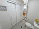 Functional bathroom layout with toilet, closet, and partial view of the dual sink vanity area at 4910 Marywood Ct, Pahrump, NV 89061