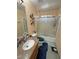 Cozy bathroom features a vanity with granite top, toilet and shower-tub combination at 4910 Marywood Ct, Pahrump, NV 89061
