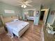 This bedroom has simple decor, wood-look floors, and a mirrored closet at 4910 Marywood Ct, Pahrump, NV 89061