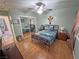 Comfortable bedroom features wood-look floors, ceiling fan and large mirrored closet at 4910 Marywood Ct, Pahrump, NV 89061