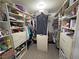 Walk-in closet with custom shelving and clothing racks, providing ample storage space for clothing and accessories at 4910 Marywood Ct, Pahrump, NV 89061