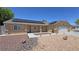 Charming single-story home featuring solar panels, rock landscaping, and an attached two-car garage at 4910 Marywood Ct, Pahrump, NV 89061