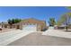 Spacious two-car garage with a wide driveway and additional parking space for multiple vehicles at 4910 Marywood Ct, Pahrump, NV 89061