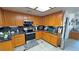 This kitchen boasts stone countertops, stainless steel appliances, and ample cabinet space at 4910 Marywood Ct, Pahrump, NV 89061