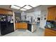 Well-lit kitchen featuring granite countertops, stainless steel appliances and breakfast bar at 4910 Marywood Ct, Pahrump, NV 89061