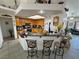 Open concept kitchen features granite countertops, stainless steel appliances and breakfast bar at 4910 Marywood Ct, Pahrump, NV 89061
