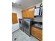 This practical laundry room features modern appliances and ample cabinet storage at 4910 Marywood Ct, Pahrump, NV 89061
