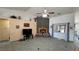 Spacious living room featuring vaulted ceilings and a cozy stone fireplace for relaxation at 4910 Marywood Ct, Pahrump, NV 89061