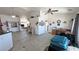 Open-concept living area with vaulted ceilings, tile floors, ceiling fans, and access to multiple rooms at 4910 Marywood Ct, Pahrump, NV 89061