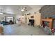 Open-concept living space features stone fireplace, tile floors and ample natural light at 4910 Marywood Ct, Pahrump, NV 89061