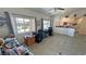 Bright living room with windows, tile flooring, and access to adjoining rooms in an open layout at 4910 Marywood Ct, Pahrump, NV 89061