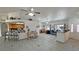 Bright open-concept living room featuring tile floors and comfortable seating at 4910 Marywood Ct, Pahrump, NV 89061