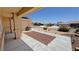 Covered front porch with concrete walkway, rock landscaping, and manicured flowerbeds around the yard at 4910 Marywood Ct, Pahrump, NV 89061