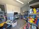 The interior of the shed is well lit and has ample shelving units for storage and organization at 4910 Marywood Ct, Pahrump, NV 89061