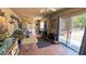 Enclosed sun room featuring tiled floors and sliding glass doors to the backyard at 4910 Marywood Ct, Pahrump, NV 89061