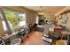 Bright sun room featuring tiled floors, multiple windows, and backyard access at 4910 Marywood Ct, Pahrump, NV 89061