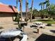 Gravel-filled grounds with BBQ grills, mature trees, and picnic tables at 5020 Indian River Dr # 432, Las Vegas, NV 89103
