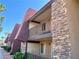 Exterior view of a two-story condo building showing stacked stone and balconies at 5020 Indian River Dr # 432, Las Vegas, NV 89103