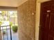Exterior of a condo entrance showing door, ADT security, and view of community tennis court at 5020 Indian River Dr # 432, Las Vegas, NV 89103