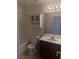 Bathroom features a vanity, mirror, and well-lit shower at 508 Candy Mint Ave, Las Vegas, NV 89183