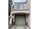 Attached garage featuring an attached balcony and covered parking at 508 Candy Mint Ave, Las Vegas, NV 89183