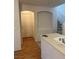Kitchen counter featuring an archway, staircase, and hardwood floors at 508 Candy Mint Ave, Las Vegas, NV 89183