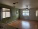 Cozy living room with a ceiling fan, hardwood floors, and natural lighting at 508 Candy Mint Ave, Las Vegas, NV 89183