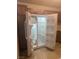 Side-by-side refrigerator with wooden cabinets in the kitchen, providing ample storage space at 508 Candy Mint Ave, Las Vegas, NV 89183
