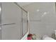 Bathroom with shower stall and neutral tiled walls at 5083 Village Dr, Las Vegas, NV 89142