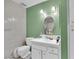 Standard bathroom featuring tiled shower, single sink vanity, and neutral color palette at 5083 Village Dr, Las Vegas, NV 89142